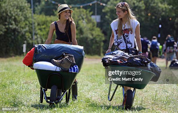 Edwina Elkington, 19 and Emma Dudlke, 18 from London arrive at the Glastonbury Festival site at Worthy Farm, Pilton on June 24, 2009 near...