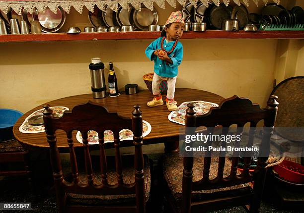 Khagendra Thapa Magar, 15 and a half, stands on the table waiting for lunch on March 13, 2007 in Pokhara, Nepal. According to the Guinness World Book...