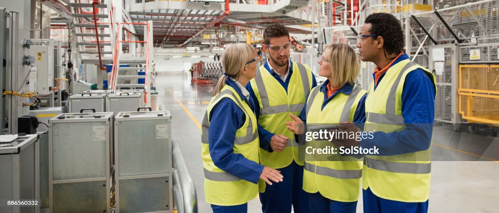 Factory Workers Discussing
