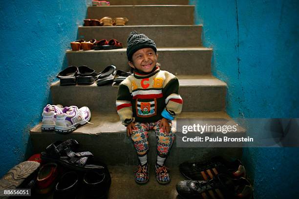 Khagendra Thapa Magar, 15 and a half, gets ready to go outside on March 13, 2007 in Pokhara, Nepal. According to the Guinness World Book of Records...