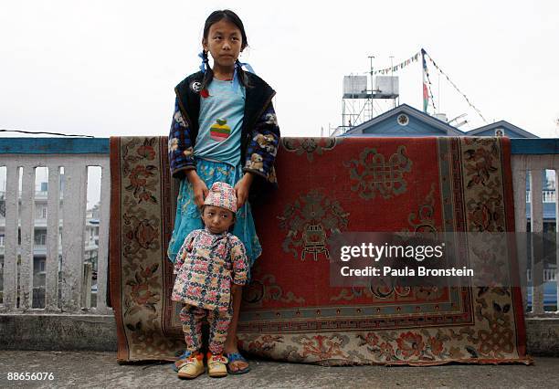 Khagendra Thapa Magar, 15 and a half, spends some time with family friend Sabina at his home on March 13, 2007 in Pokhara, Nepal. According to the...