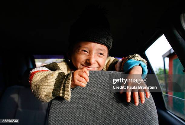 Khagendra Thapa Magar, 15 and a half, enjoys an afternoon going for a ride in the car to Fewa Lake with his manager Min Bahadur Rana Magar on March...