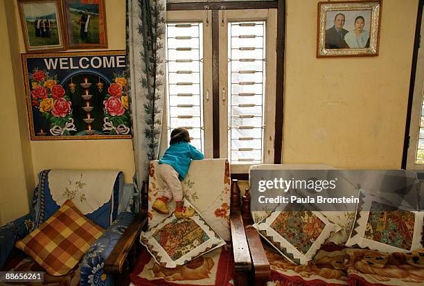 Khagendra Thapa Magar, 15 and a half, looks out of a window on March 12, 2007 in Pokhara, Nepal. According to the Guinness World Book of Records when...