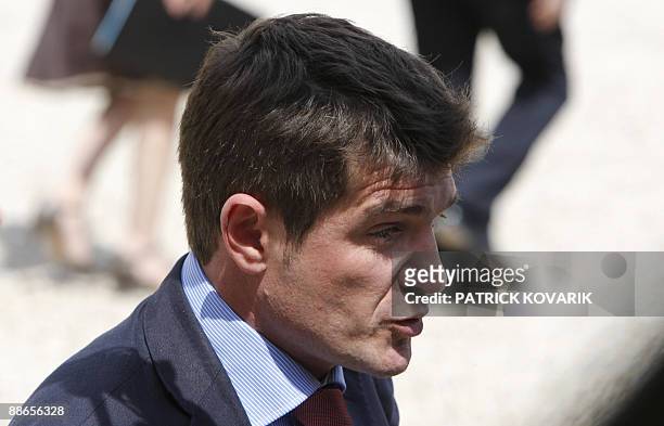 New French Housing minister Benoist Apparu speaks to the press upon arrival on June 24, 2009 for a cabinet meeting at the Elysee palace. French...