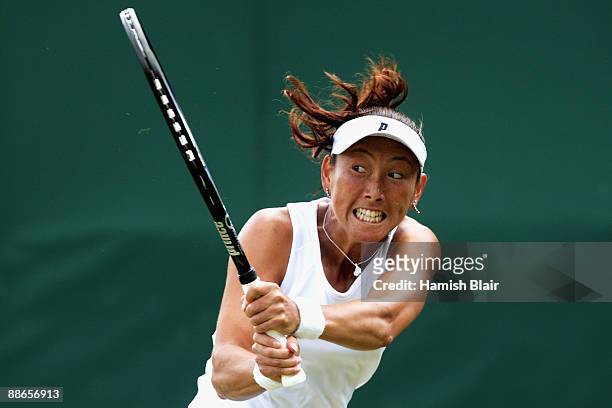 Ai Sugiyama of Japan plays a backhand during the women's singles second round match against Arantxa Parra Santonja of Spain on Day Three of the...