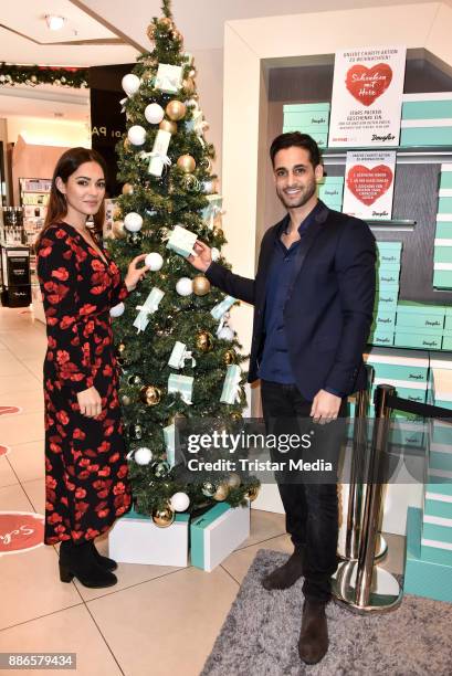 Nilam Farooq and Karim Duezguen Guenes during the X-Mas Charity Campaign 'Schenken mit Herz' on December 5, 2017 in Berlin, Germany.