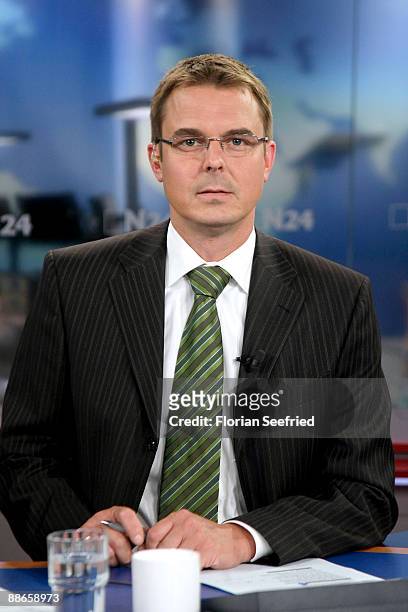Host of N24 Thomas Klug poses in the N24 studio at Potsdamer Platz on June 24, 2009 in Berlin, Germany. The N24 newsroom, which moved to Potsdamer...
