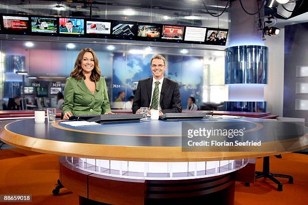 Hosts of N24 Tatjana Ohm and Thomas Klug pose in the N24 studio at Potsdamer Platz on June 24, 2009 in Berlin, Germany. The N24 newsroom, which moved...