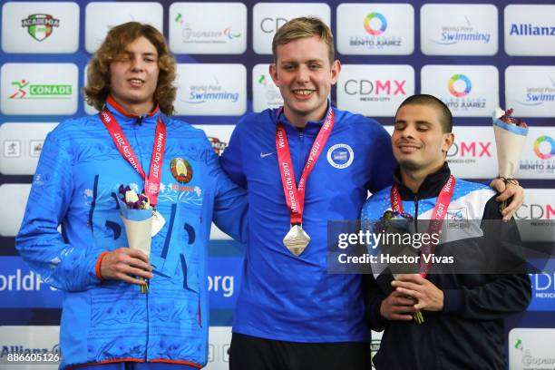 Bronze Sergio Zayas of Argentina, gold medal Drake Tharon of USA and Hryhory Azudzilau of Belarus pose after the Men's 400m Freestyle S11 Final...