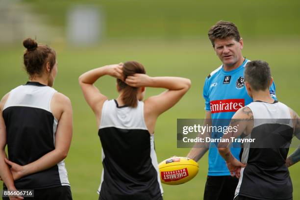 Collingwood assistant coach Robert Harvey takes the AFLW team through some drills during a Collingwood Magpies men's and women's joint AFL pre-season...