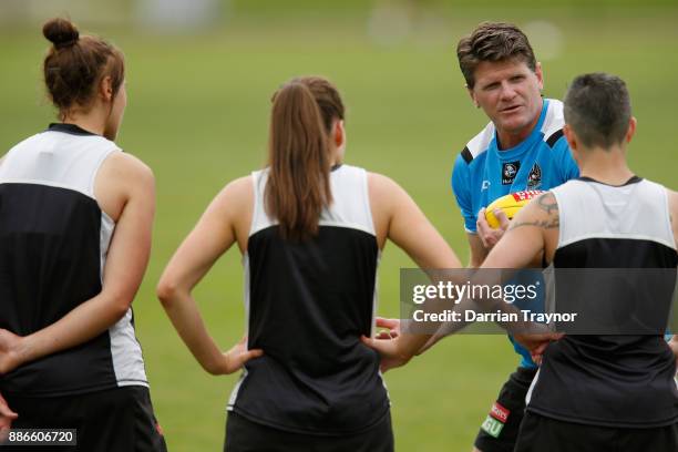 Collingwood assistant coach Robert Harvey takes the AFLW team through some drills during a Collingwood Magpies men's and women's joint AFL pre-season...