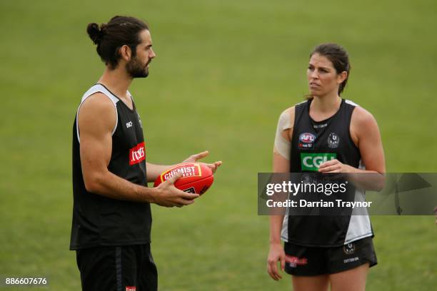 Brodie Grundy and Eliza Hynes chat during a Collingwood Magpies men's and women's joint AFL pre-season training session at the Holden Centre on...