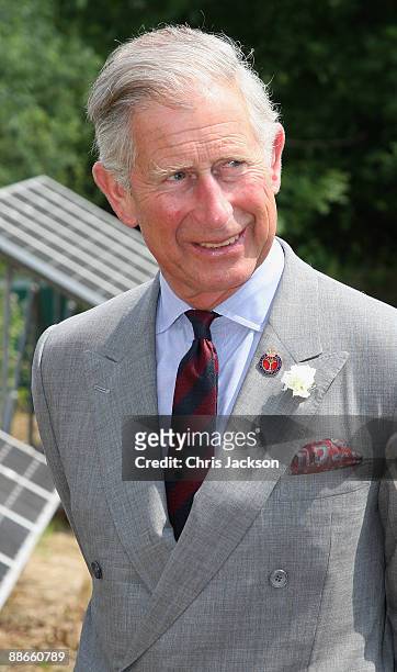 Prince Charles, Prince of Wales talks in front of solar panels during a visit to Ecodysgu Holistic Education Centre on June 24, 2009 in Tondu, Wales....