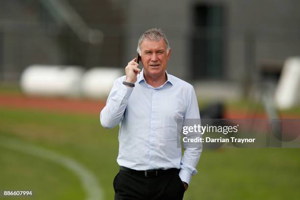 Collingwood Head of Football Geoff Walsh talks on the phone during a Collingwood Magpies men's and women's joint AFL pre-season training session at...