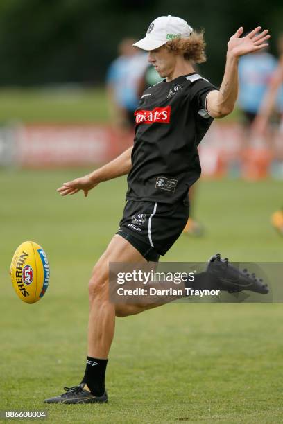 Chris Mayne kicks the ball during a Collingwood Magpies men's and women's joint AFL pre-season training session at the Holden Centre on December 6,...