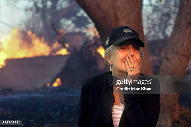 Judy Hofmann-Sanders can only watch as her home is consumed by the Creek fire along McBroom Street in Shadow Hills.