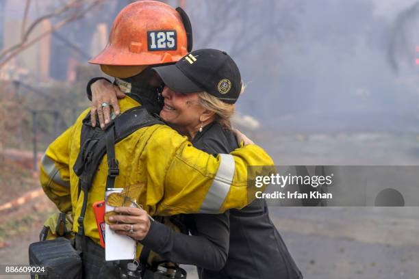 Firefighter Hug Photos and Premium High Res Pictures - Getty Images