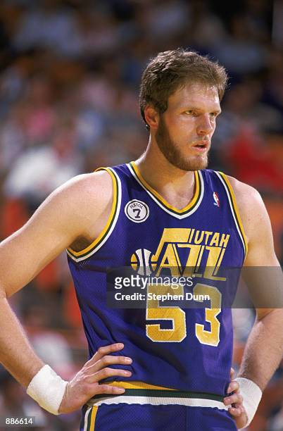 Mark Eaton of the Utah Jazz rests during an NBA game at The Salt Palace in Salt Lake City, Utah in 1988.
