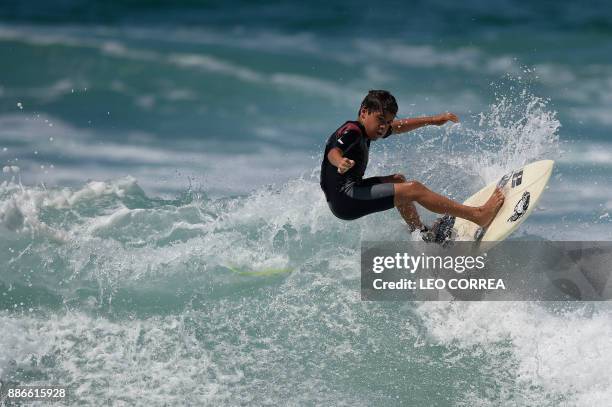 Young surfer Rickson Falcao rides a wave at Saquarema's beach in Rio de Janeiro state, Brazil, on November 29, 2017. Despite its vast Atlantic...