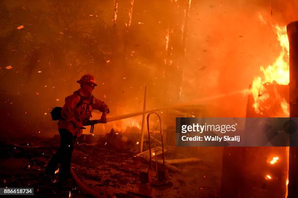 Firefighter battles the Thomas Fire along Highway 33 in Casita Springs in Ventura County Tuesday.