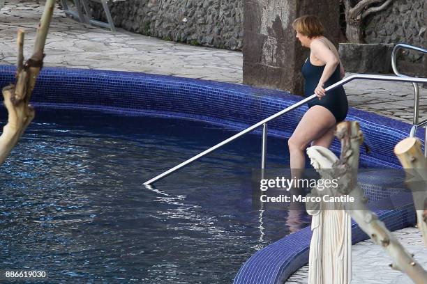 German Chancellor Angela Merkel, enters the spa pool, during the Easter holidays on the island of Ischia.