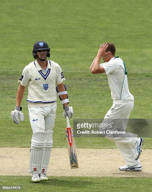 Sam Rainbird of Tasmania celebrates taking the wicket of Steve O'Keefe of NSW during day four of the Sheffield Shield match between New South Wales...