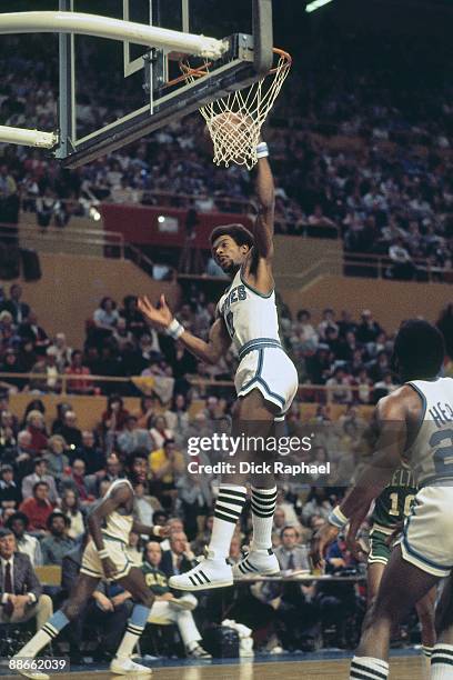 Randy Smith of the Buffalo Braves rebounds against the Boston Celtics during a game played in 1974 at the Buffalo Memorial Auditorium in Buffalo, New...