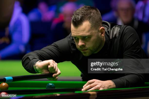 Jimmy Robertson of England plays a shot during his third round match against Shaun Murphy of England on day 9 of 2017 Betway UK Championship at...