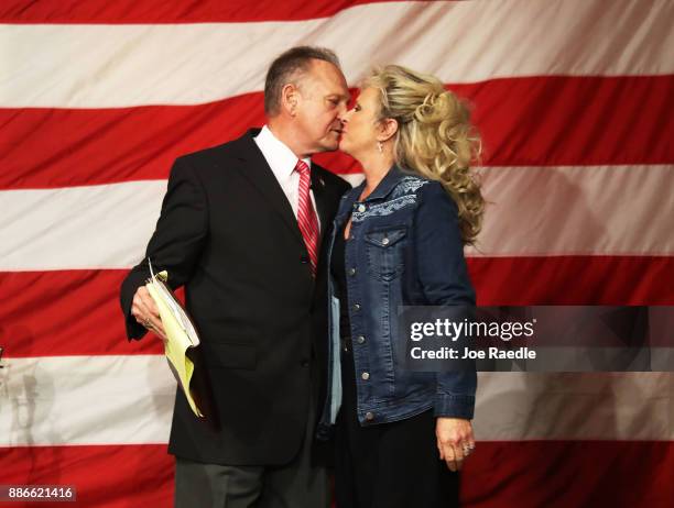 Republican Senatorial candidate Roy Moore kisses his wife Kayla Moore during a campaign event at Oak Hollow Farm on December 5, 2017 in Fairhope,...