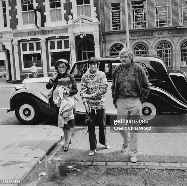 Cookery editor of the Daily Express Sheila Hutchins, with costume designer Shirley Ann Kingdon and husband, film director Ken Russell , UK, 16th June...