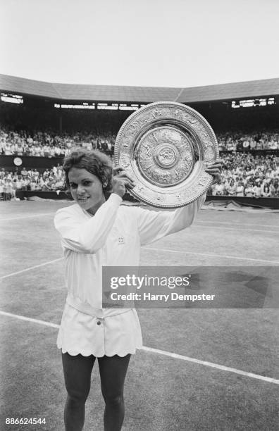 Australian tennis player Evonne Goolagong holds the Women's Singles Trophy after winning the final at the Wimbledon Lawn Tennis Championships, All...