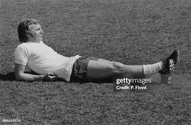 British soccer player Bobby Moore relaxing during England training session, UK, 19th May 1971.