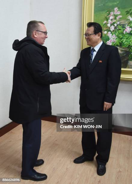 Senior United Nations official Jeffrey Feltman shakes hands with North Korean Vice Foreign Minister Pak Myong Guk at the People's Palace of Culture...