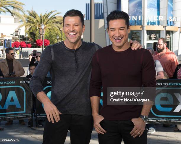 Mark Wright and Mario Lopez visit "Extra" at Universal Studios Hollywood on December 5, 2017 in Universal City, California.