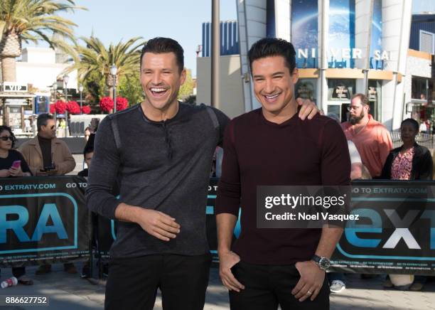 Mark Wright and Mario Lopez visit "Extra" at Universal Studios Hollywood on December 5, 2017 in Universal City, California.