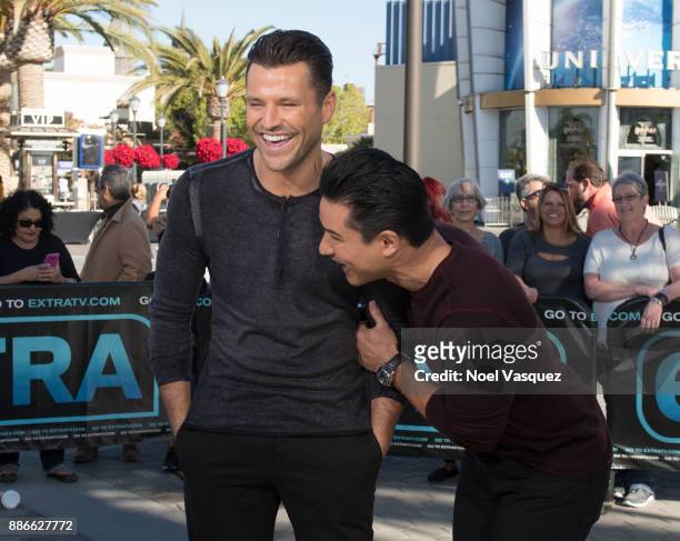 Mark Wright and Mario Lopez visit "Extra" at Universal Studios Hollywood on December 5, 2017 in Universal City, California.