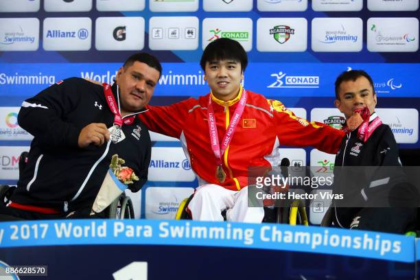 Arnulfo Castorena of Mexico , Huang Wengpan of China and Cristopher Tronco of Mexico pose after the Men's 50m Breaststroke SB2 Final during day 4 of...