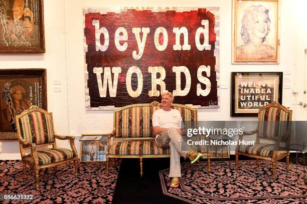 Peter Tunney poses with his work at Wynwood Walls Presents: humanKIND 2017 at Wynwood Walls on December 5, 2017 in Miami, Florida.