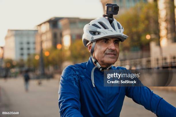 a senior man on his street bike - wearable camera stock pictures, royalty-free photos & images
