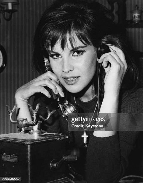 Italian actress Antonella Lualdi in a scene from the film 'Le repas des fauves', being filmed at the Saint-Maurice studios in France, 1964. The film...