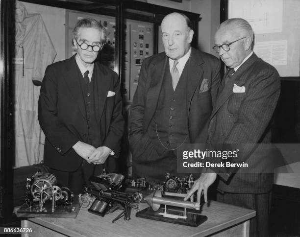 Research physicist Professor Archibald Montgomery Low hands over the control gear of the world's first guided missile to the Imperial War Museum in...