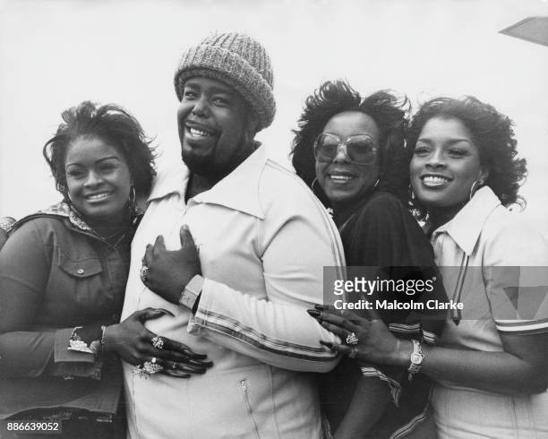 American soul singer Barry White with his backing group Love Unlimited whilst in London for a tour, 15th March 1977. From left to right, Glodean...