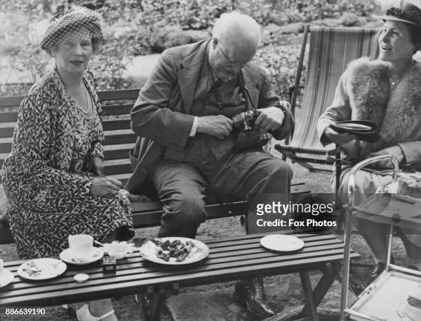 From left to right, writer Winifred Graham , amateur photographer Lord Louth and Lady Gibbs, wife of writer Sir Philip Gibbs, at St Albans, Graham's...