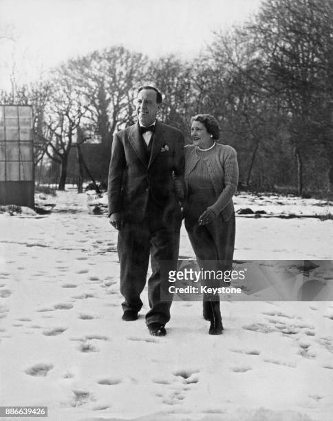 English actor Ralph Lynn and his wife Gladys in the grounds of their home in Tadworth, Surrey, UK, 12th January 1953.