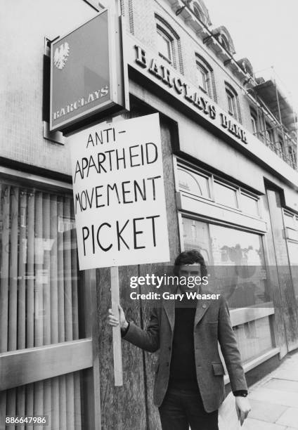 British activist and politician Peter Hain leads an anti-apartheid demonstration outside Barclays Bank in Richmond Road, Putney, London, 20th January...