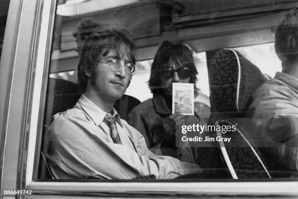 Musicians John Lennon and George Harrison of English rock band the Beatles during the filming of 'Magical Mystery Tour' in Devon, UK, 1967.