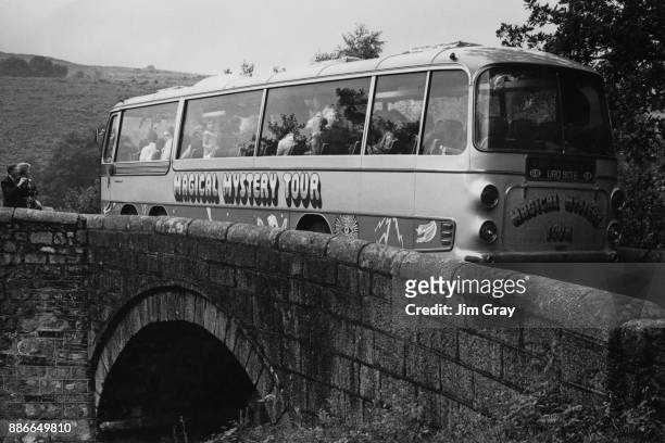 The coach carrying English rock band the Beatles during the filming of 'Magical Mystery Tour' gets stuck on a small bridge near Dartmoor, UK, 13th...