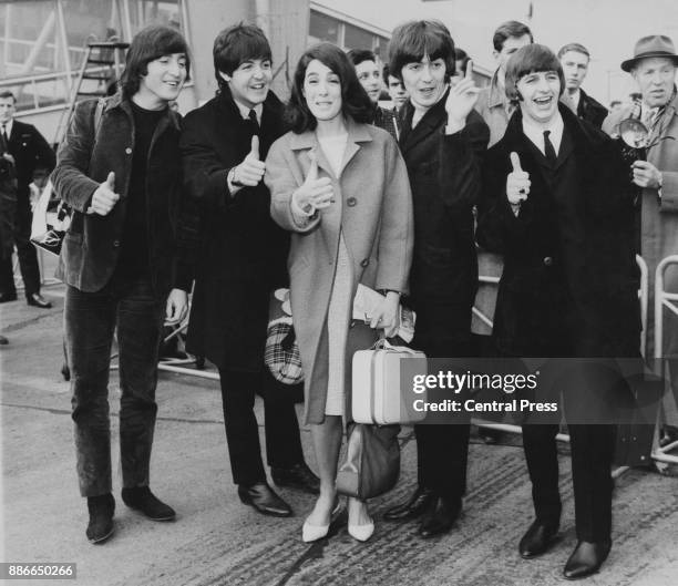 English actress Eleanor Bron poses with British rock group the Beatles: John Lennon, Paul McCartney, George Harrison and Ringo Starr, at London...