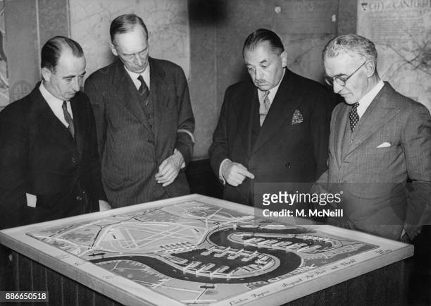 From left to right, unknown, J. F. Collin, the Chief Housing Inspector at the Ministry of Health, Ernest Brown , the Minister of Health, and Arthur...