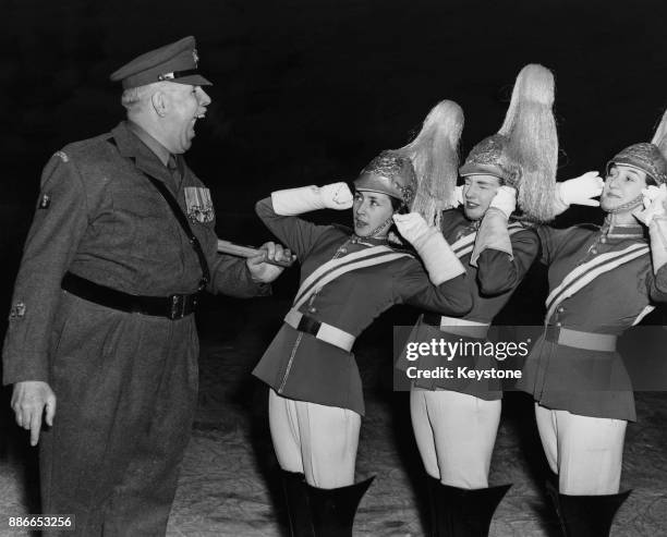 Former Regimental Sergeant Major Ronald Brittain of the Coldstream Guards uses his famous voice on Margaret Patterson, Gill Caterham and Jenny Leach...